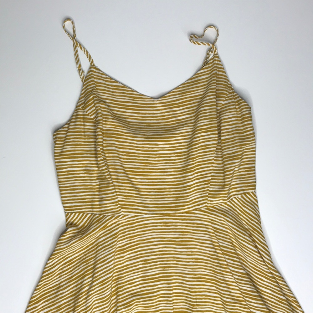 Yellow striped spaghetti strap dress.